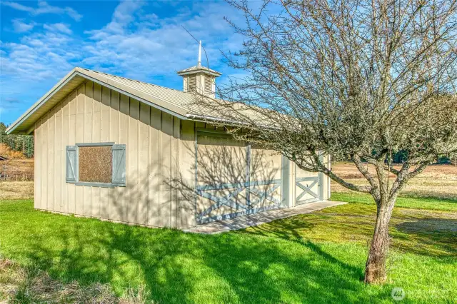 The detached three-bay garage with room for storage.