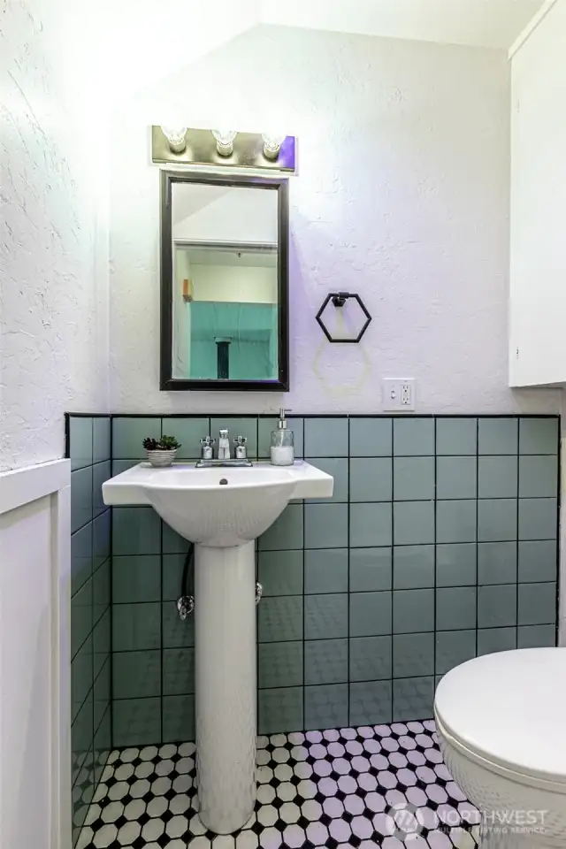 Modern remodeled half bath.