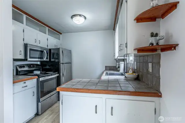 The kitchen has newer stainless steel appliances and plenty of cabinet space!