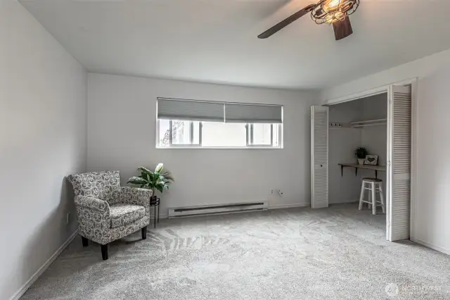 Larger of the 2 bedrooms upstairs has great ceiling fan and tons of space!