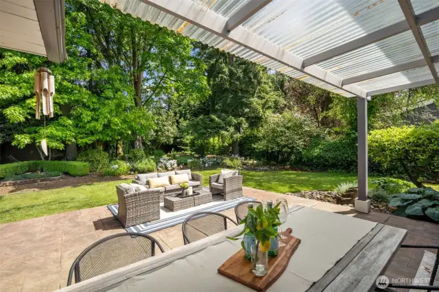 Patio with dining area and seating area
