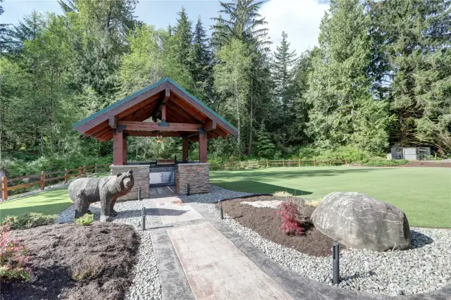 Outdoor Kitchen, stamped concrete walkway, adjacent to low maintenance astro turf lawn.