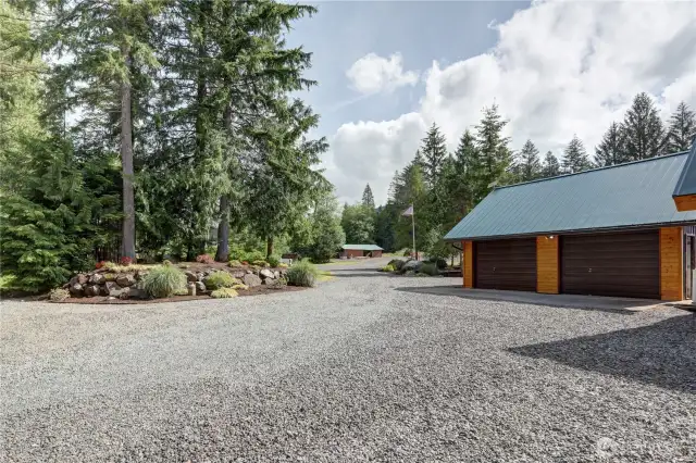 Detached 2 car garage with electricity and an air compressor line.