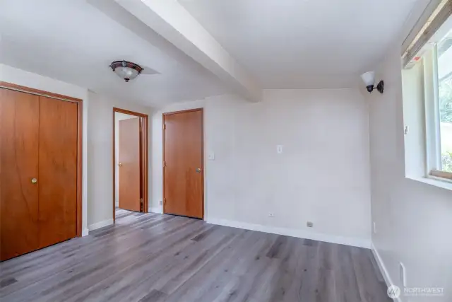 Bedroom off the garage features half bath