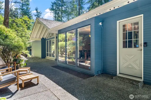 Tucked just off the main walkway, this convenient side entry leads directly into the kitchen—ideal for unloading groceries or stepping out to relax on the patio.
