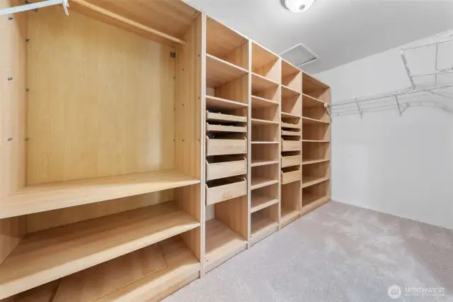 A truly expansive walk-in closet with custom shelving and ample storage—designed to keep everything beautifully organized.