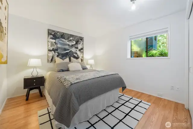 Freshly painted and tucked away on the lower level, Bedroom #2 offers comfort and privacy with warm natural light and stylish modern accents.