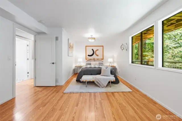 Bedroom #4: offers generous space and more serene forest views. Whether used as a guest retreat, or creative flex space, it’s a peaceful haven with endless versatility.