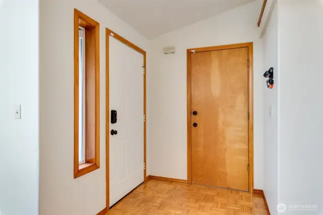 Light and bright entry with vaulted ceiling and coat closet sets the tone for the open interior layout.