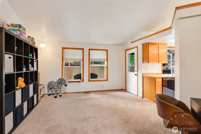 Flexible bonus space off the kitchen—perfect as a playroom, home gym, or second living area.