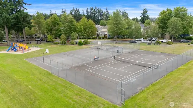 Enjoy neighborhood amenities like this community tennis and basketball court—just a short stroll from home.