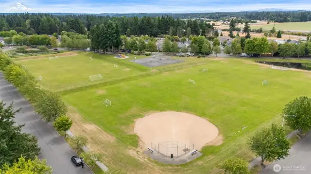 Community park includes a baseball diamond and open play space for all ages to enjoy.