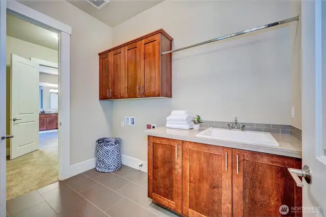 Main Floor Utility Room, connects to Primary closet.