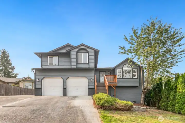 Large driveway with 2 door attached garage.