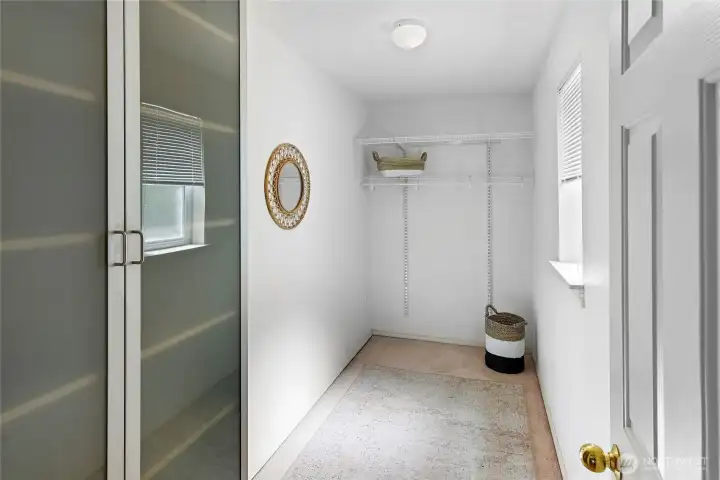 Walk in closet for bedroom 2 of 3. Cabinet on left conveys