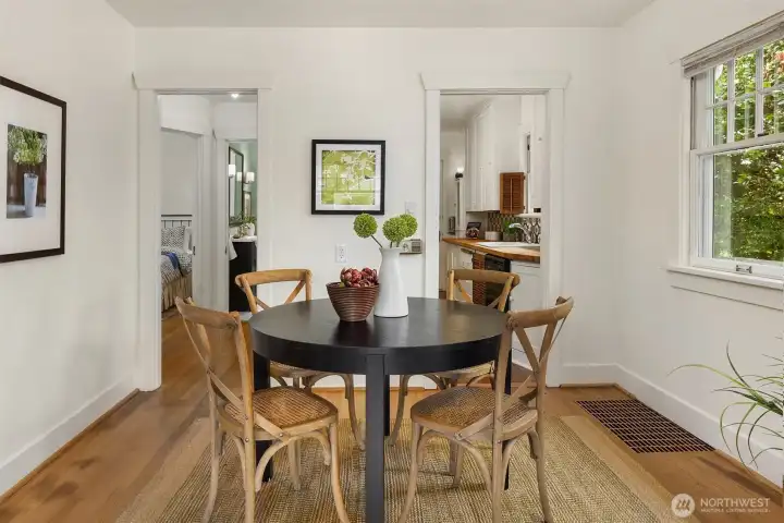Dining looking toward the kitchen and hallway to the bedrooms