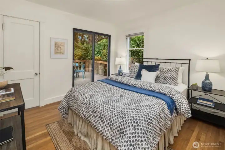 Primary bedroom with access to the back deck.