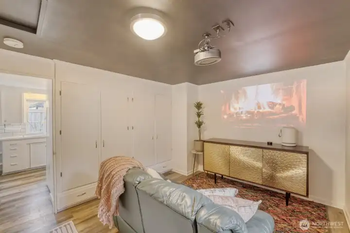 Right off the kitchen for grabbing more popcorn!