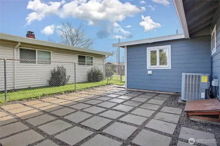 Rear exterior view highlighting newer Hardiplank siding and heat pump system.