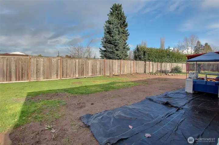 Large fully fenced backyard offering space for play, gardening, or future landscaping.