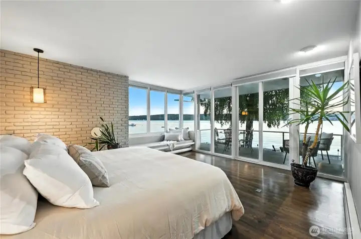 Primary bedroom with walls of windows.