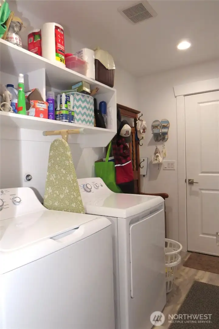 The convenient laundry room has a doorway leading to the single car garage!