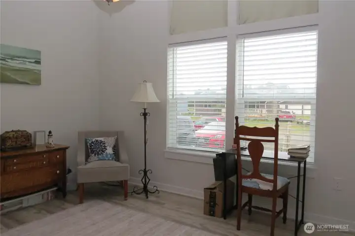 The sunny guest room or office has vaulted ceilings and large sunny windows!