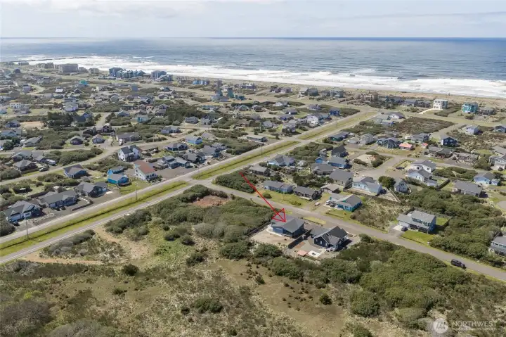 Aerial view of your new home where you can hear the crashing waves of the Pacific Ocean and Jetty!