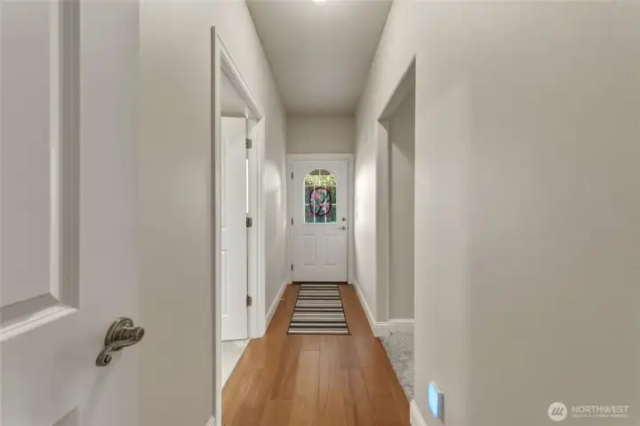 Hallway to private Primary suite & North side deck