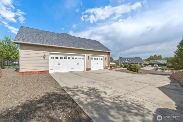 3 car garage w/ RV parking area & hookup