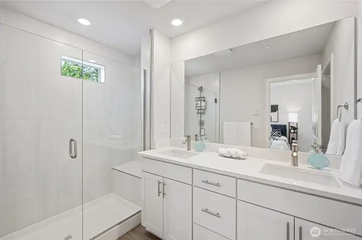 Modern bathroom with dual quartz vanities