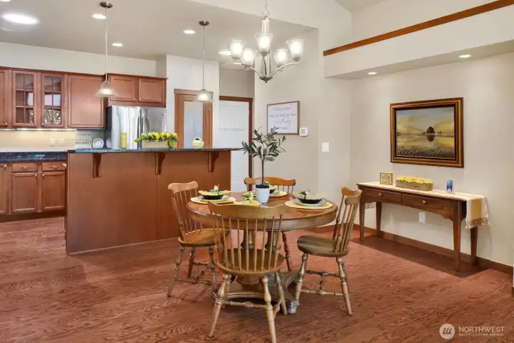 Note the bar seating on the island as well as the bump out creating just the right spot to make a statement with a special piece of furniture or artwork.