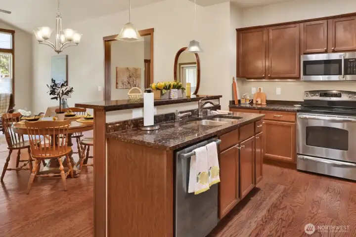 The center island in the kitchen houses the sink & dishwasher.