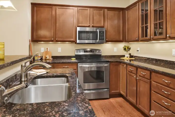 Generous work spaces and cabinets including a large pantry.