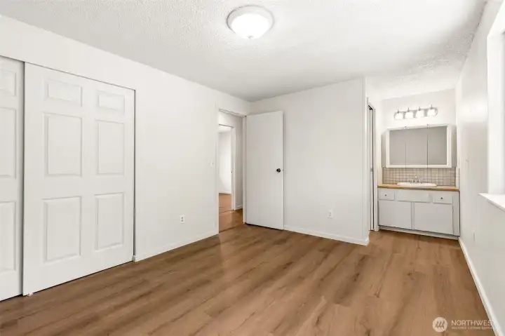 Master bedroom with bathroom in the back ground