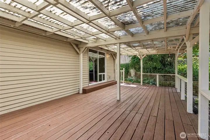 Covered back porch perfect for extended living area for you BBQ's