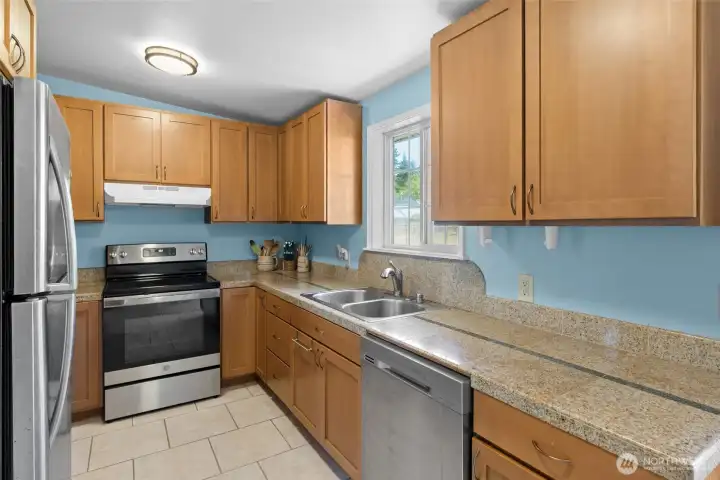Updated Kitchen Features Stainless Steel Appliances and Granite Tile Countertops Updated Kitchen Features Stainless Steel Appliances and Granite Tile Countertops