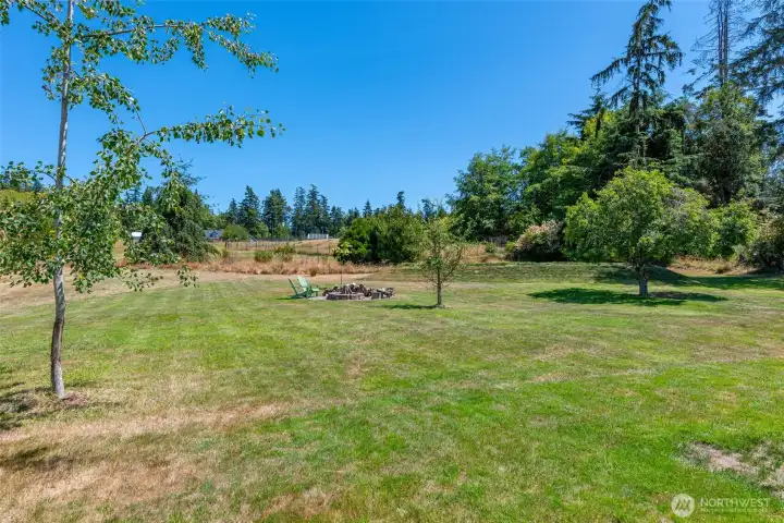 Large Fire Ring for those Spectacular Summer Nights. The Large Mound in the Rear of the Photo is the New Septic System. Large Fire Ring for those Spectacular Summer Nights. The Large Mound in the Rear of the Photo is the New Septic System.