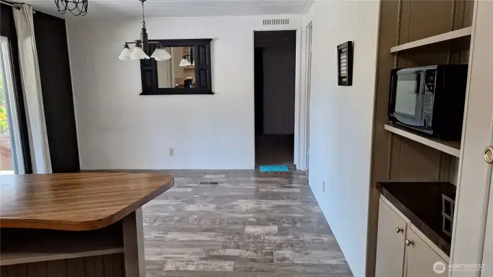 THE DARK DOOR LEADS INTO THE PRIMARY BEDROOM, WITH PRIMARY BATH