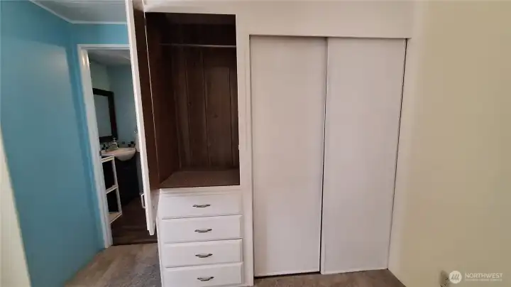 2ND BEDROOM WITH GOOD SIZE WALL CLOSET AND BUILT IN DRESSER WITH EXTRA CLOSET ABOVE.