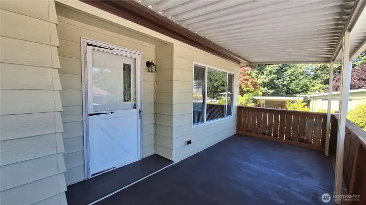 ENTRAANCE INTO LIVING ROOM FROM LARGE DECK.