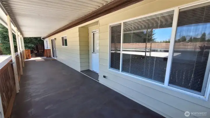 EASY TO KKEEP YOUR EYE ON THE KIDS OR PET PLAYING ON THIS CLOSED IN HUGE DECK & A GLASS SLIDER ON THE OTHER END WITH GATE AND STAIRS GOING INTO THE BACK YARD