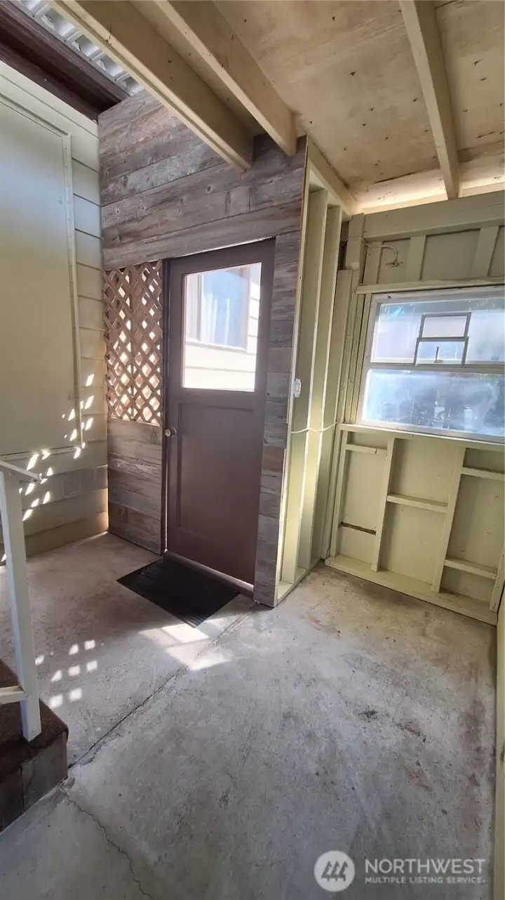 STAIRS OFF HOME ENTRANCE NEXT TO CARPORT LEADING TO BACK YARD