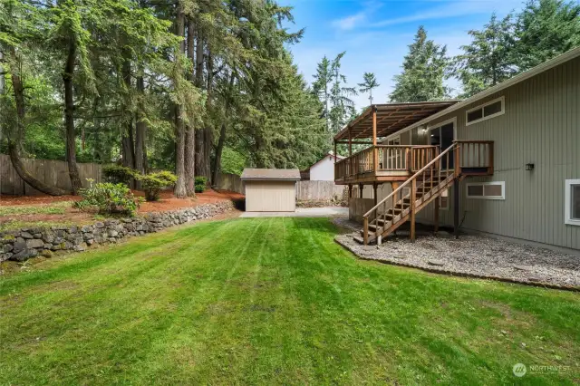 This home enjoys a beautiful back yard with a garden shed and easy access up to the covered deck.