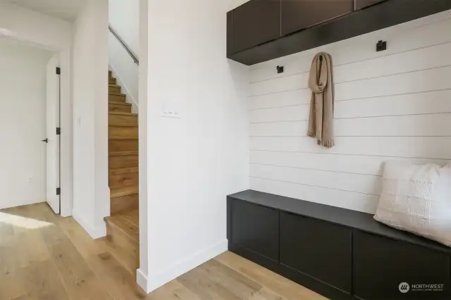 Formal Entry with Accent Wall and Built-In Bench and Cabinets