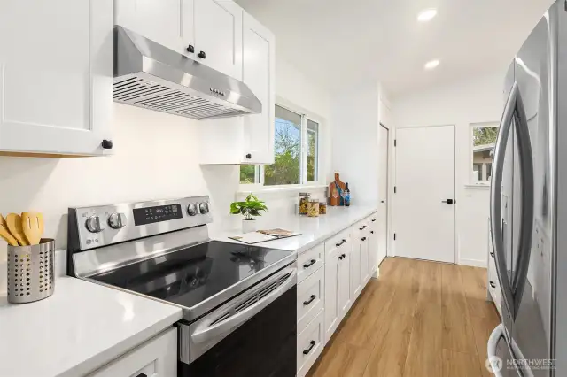 Kitchen,  New Cabinets, Quartz Counters and Stainless Sink & Appliances. New LVP Flooring