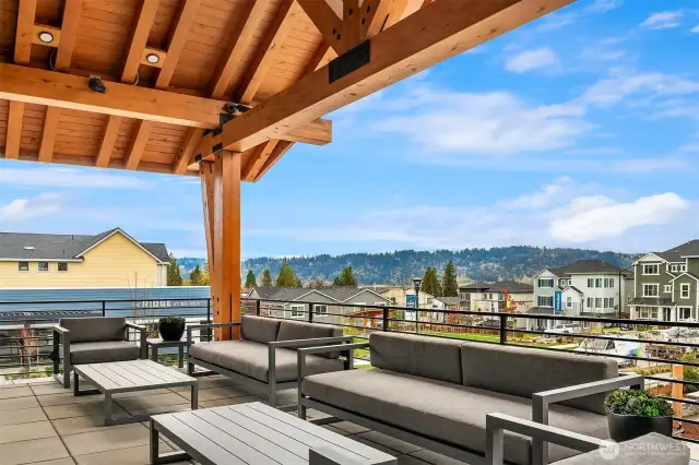 Cozy outdoor fireplace seating w/stunning westerly views.