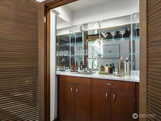 A charming nod to the '60s, the wet bar with modern updates seamlessly blend with the many entertaining parts of the  home.