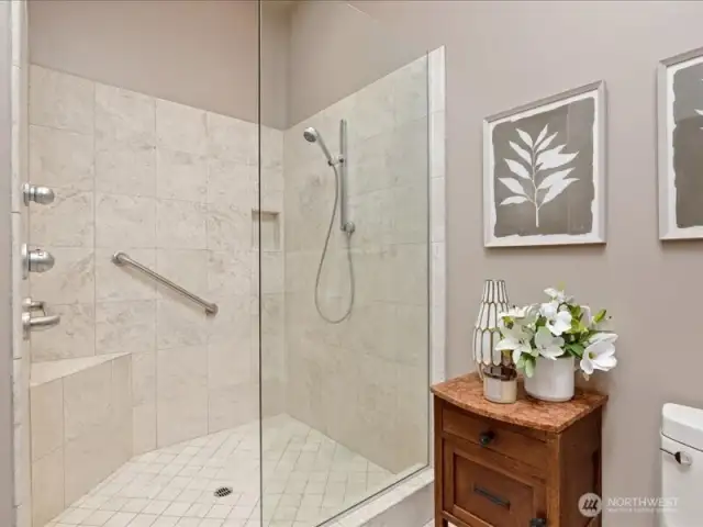 Large walk-in travertine shower.