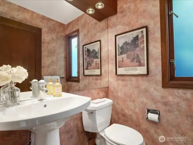 The lovely guest powder room is quietly tucked away from the hustle and bustle of the party.